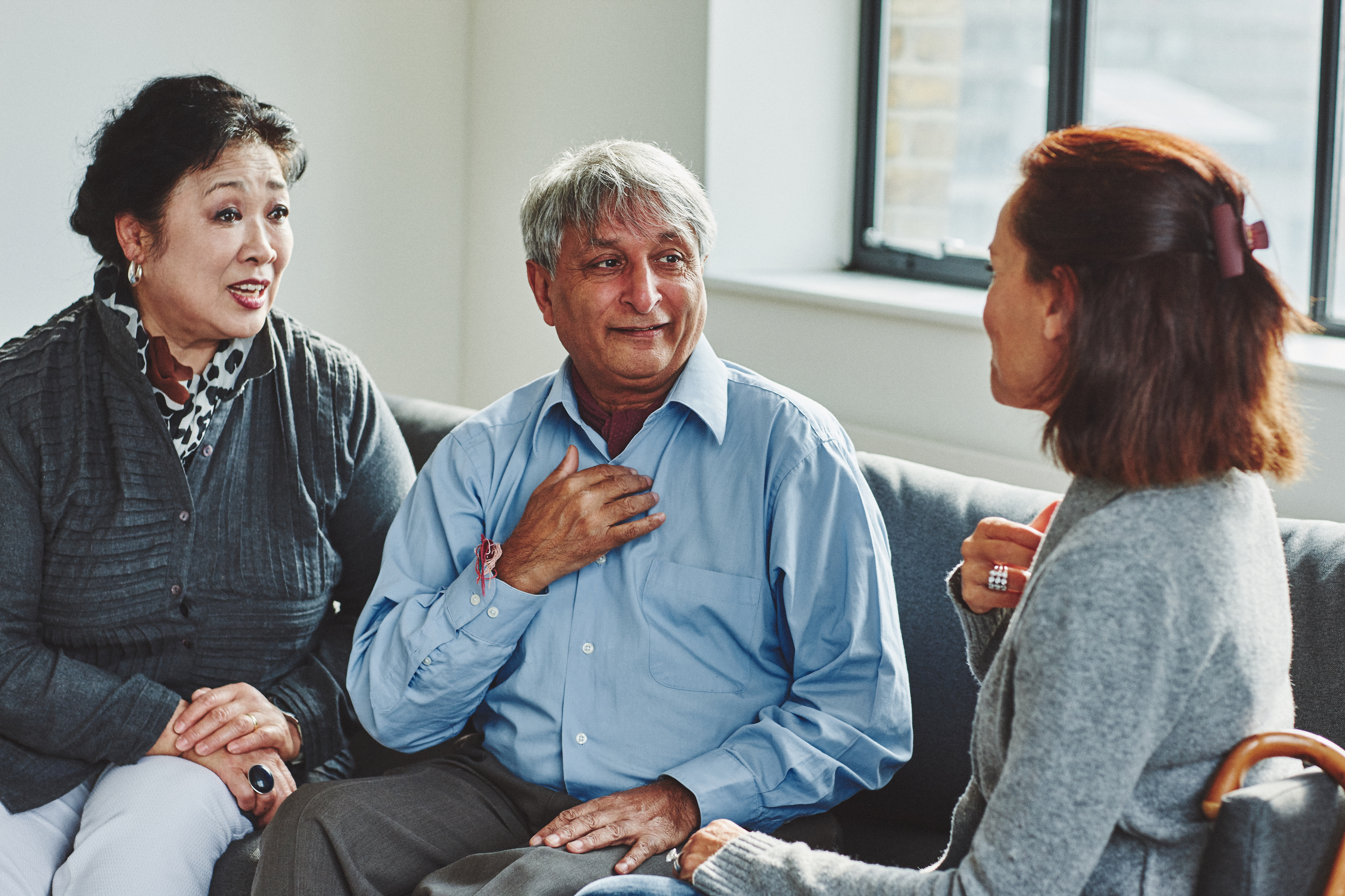 Three people in conversation 