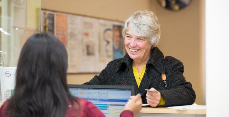 Woman smiling at GP