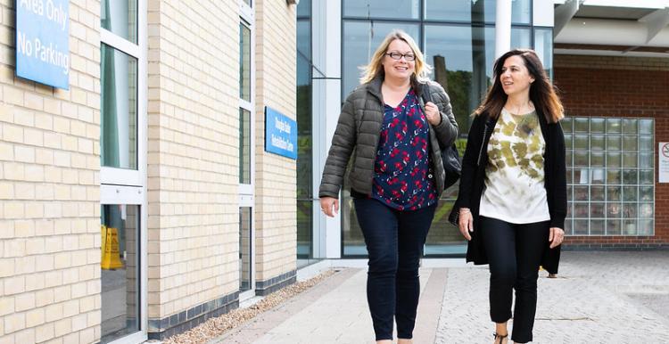 Two woman walking