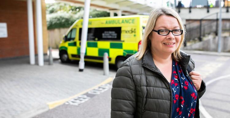 woman standing outside hospital