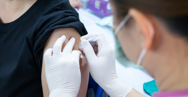 woman receiving vaccination