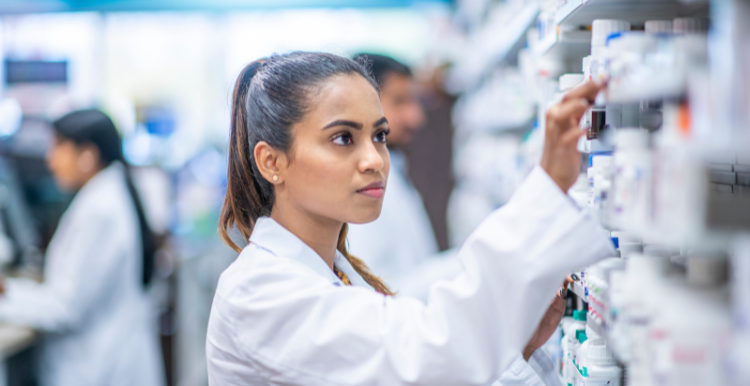 woman choosing medication in pharmacy