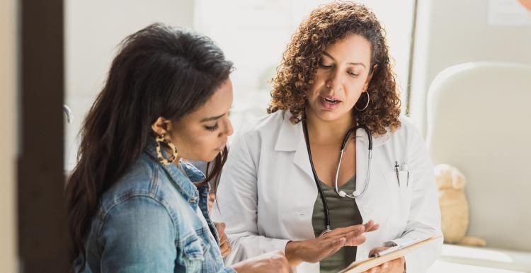 Female doctor providing information to female patient