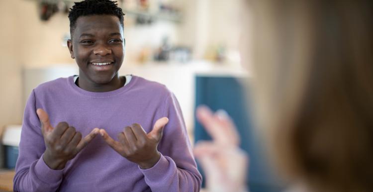 teenage boy and girl talking in sign language.jpg