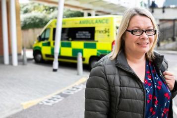 woman standing outside hospital