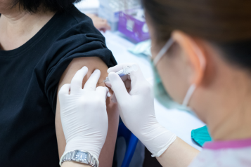 woman receiving vaccination