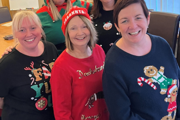 The 5 ladies of Healthwatch Stockport wearing  Christmas jumpers