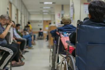 Hospital waiting room busy with patients 