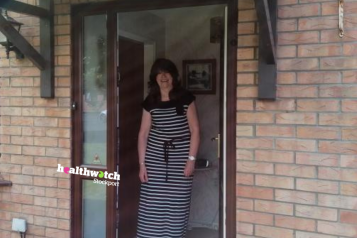 Maria standing in door