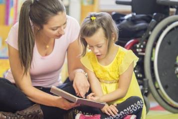 Woman looking after girl