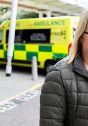 woman standing outside hospital