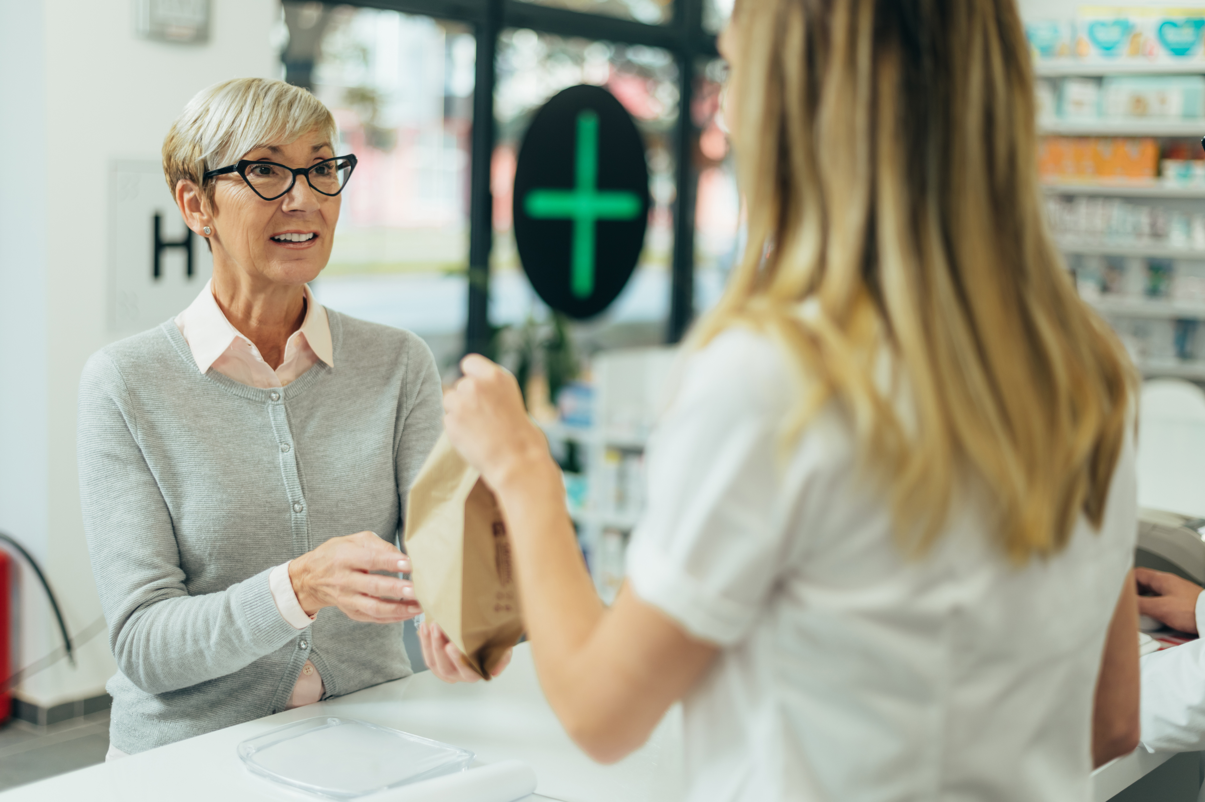 Woman stood at pharmacy counter